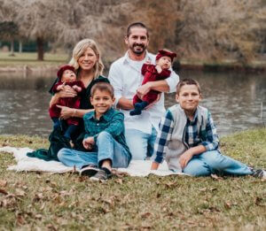 Reesa and Corey with their boys Levi and Liam and identical twin daughters Maeve and Miley